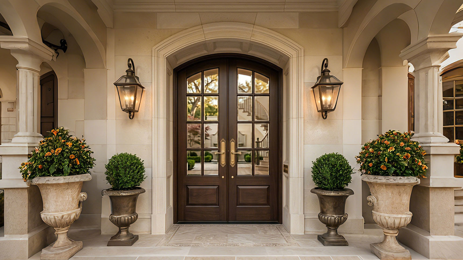 Custom French Arched Solid Wood Double Entry Doors with Glass Panels installed in a luxury home