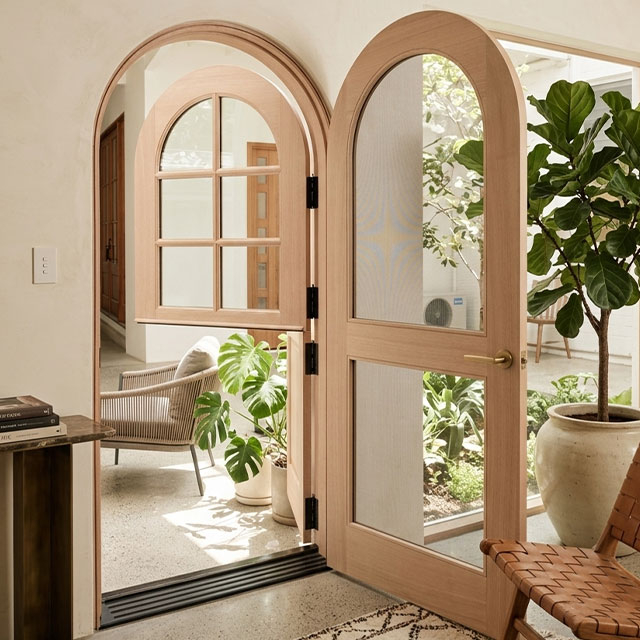 Custom arched timber Dutch door with screen 