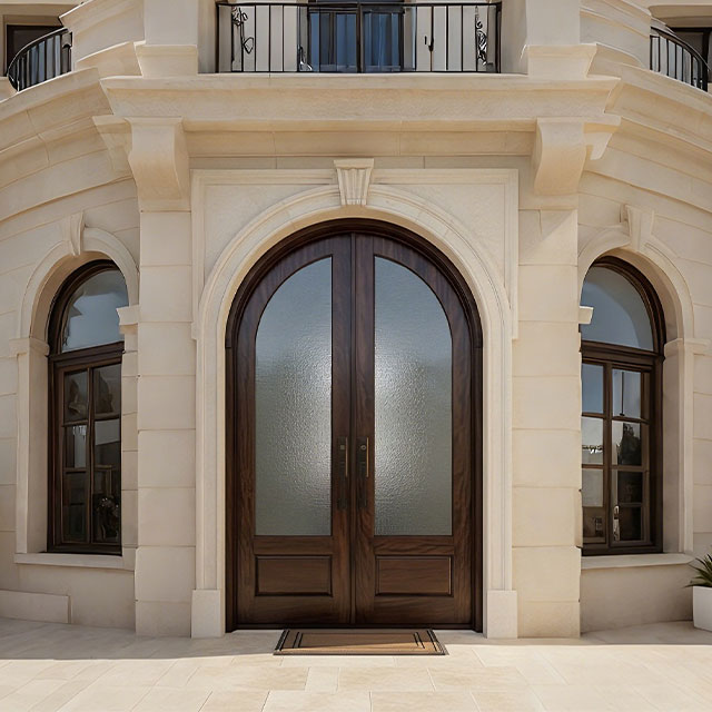 Arched wood and glass front double door